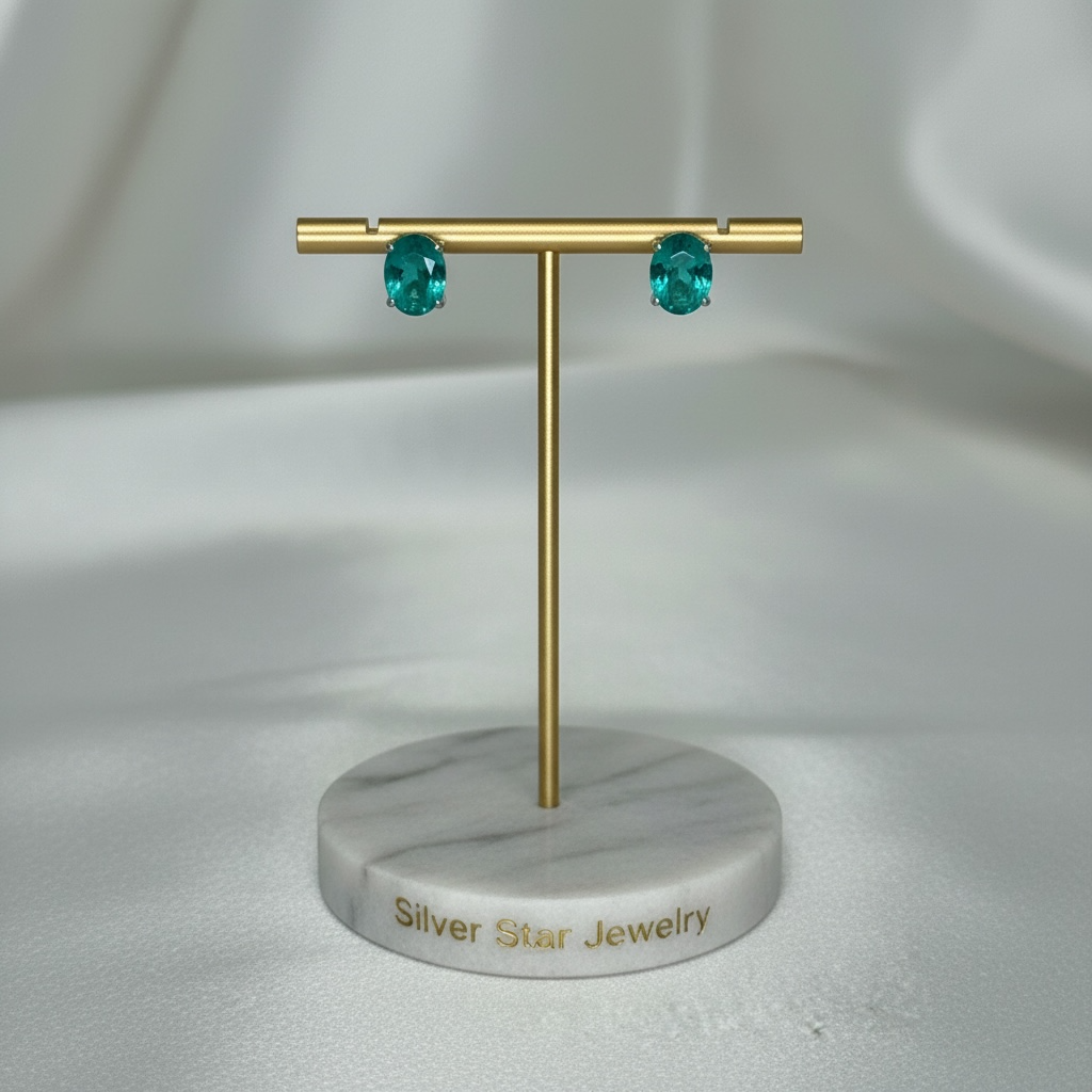 Aretes Topo Oval Esmeralda Verde en Garra